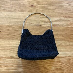 Vintage women’s black purse with silver tone handles